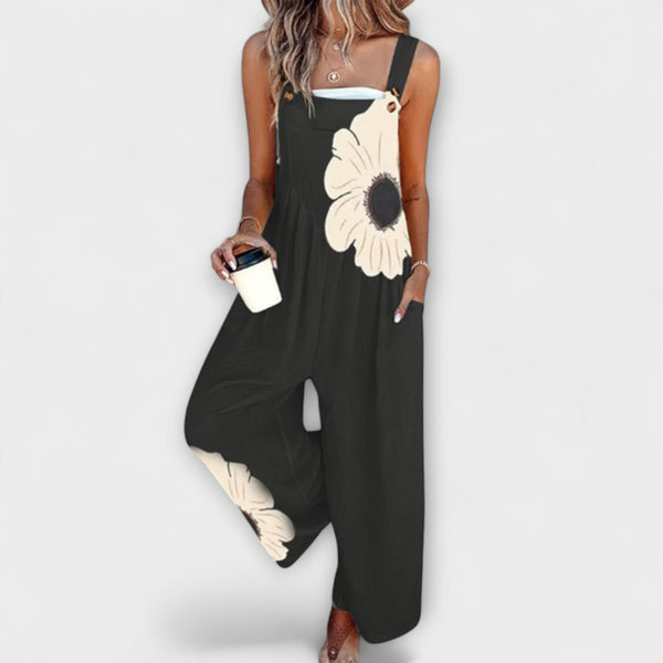 Clémentine - Schwarze Latzhose mit grosser Blüte